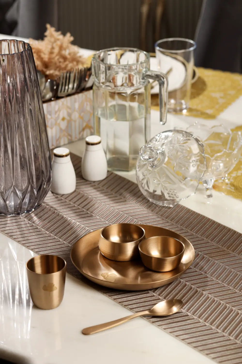 Kansa Utensils Handcrafted Kansa Mini Plate Set displayed in an elegant dining table setting by Parami