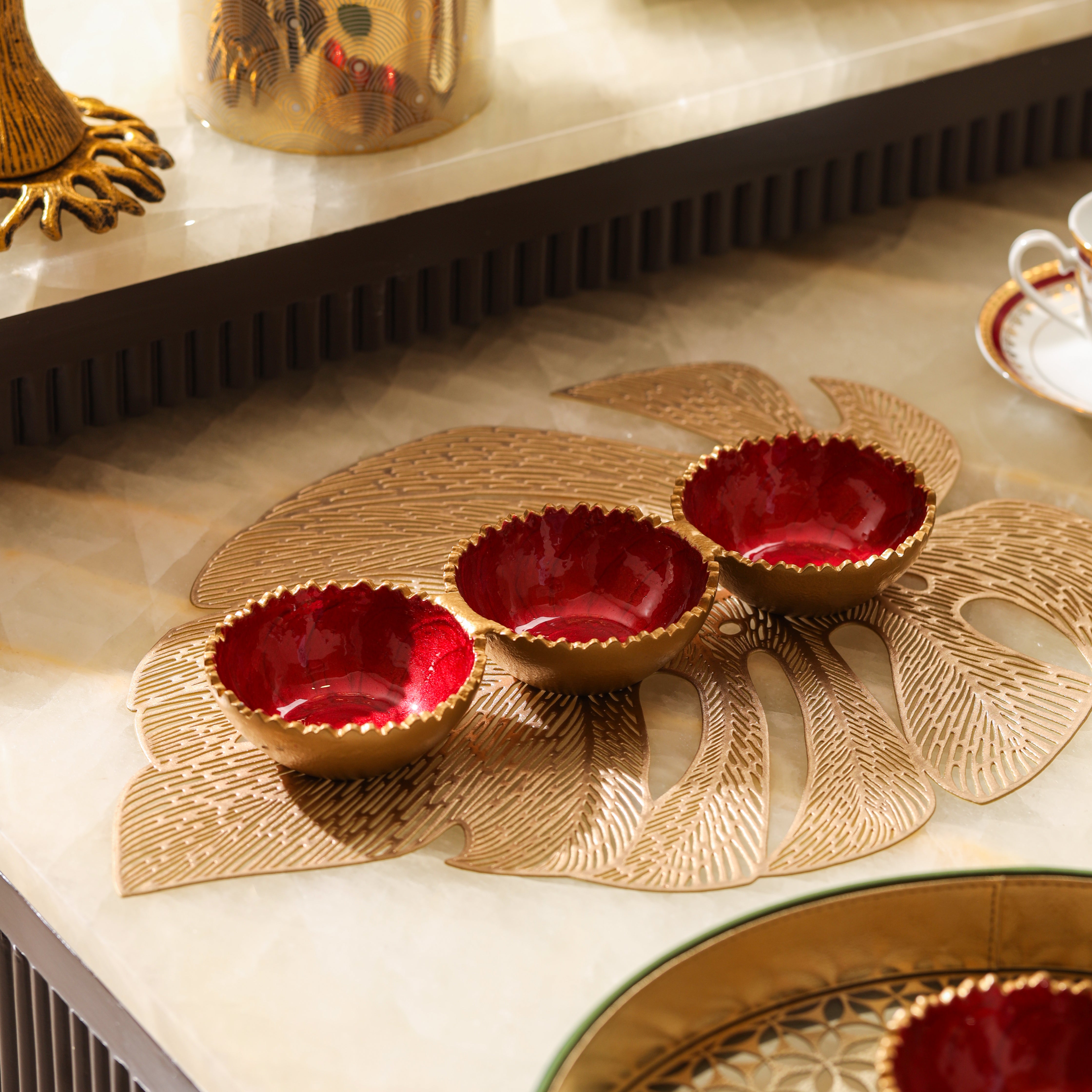 Serving bowl set with red ripple design for dining table setup by Parami
